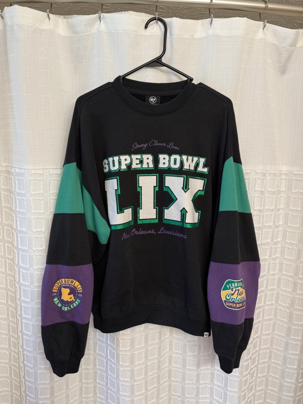 Stoney Clover Lane Black Sweatshirt with Green and Purple Accents